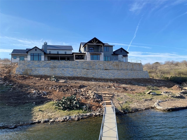 view of dock with a water view