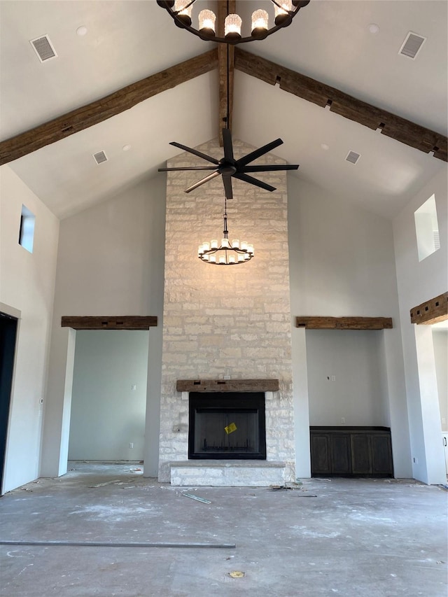 unfurnished living room featuring beam ceiling, a stone fireplace, and high vaulted ceiling