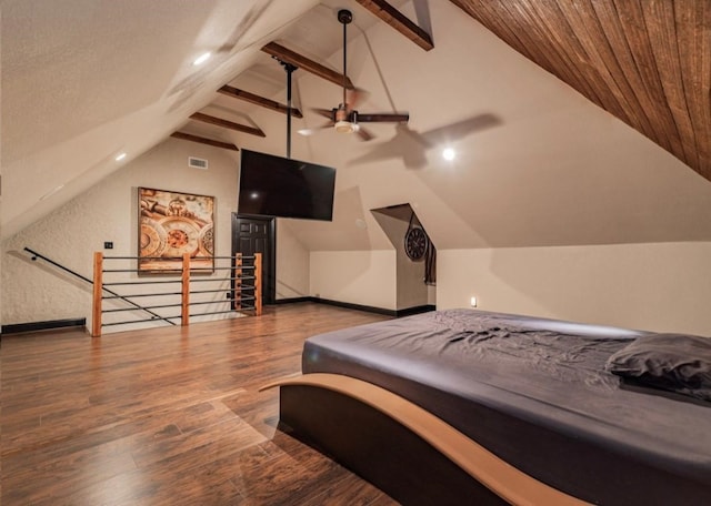 bedroom featuring dark wood-type flooring and vaulted ceiling