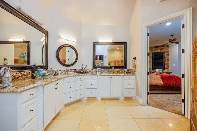 bathroom featuring ceiling fan, tile flooring, and vanity