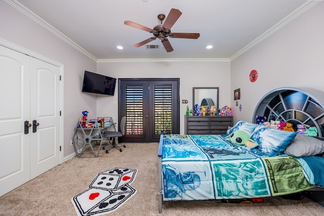 carpeted bedroom with a closet, ornamental molding, ceiling fan, and french doors