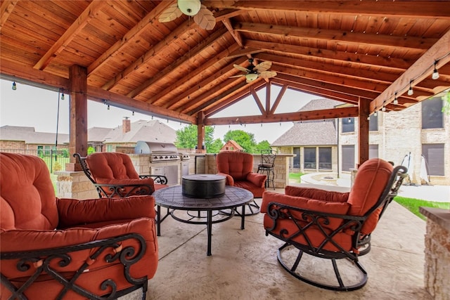 view of terrace with outdoor lounge area, area for grilling, a gazebo, and an outdoor kitchen