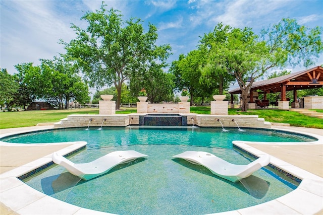 view of swimming pool with pool water feature, a lawn, and a gazebo