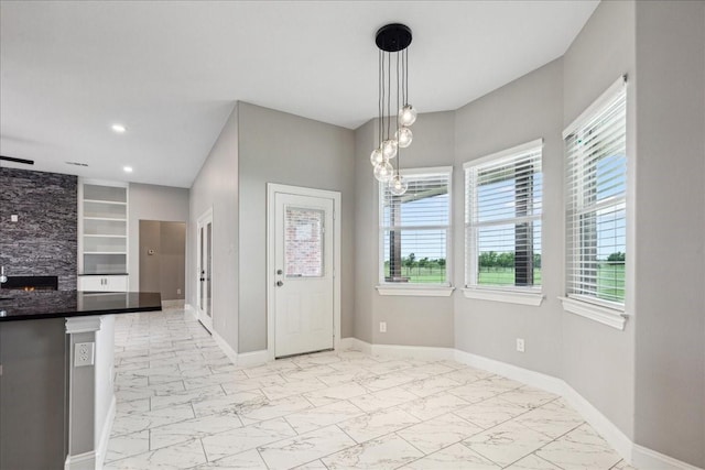 foyer entrance featuring a fireplace