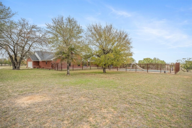 view of yard featuring a rural view and fence