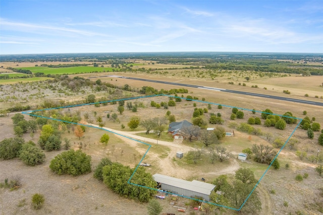 birds eye view of property featuring a rural view