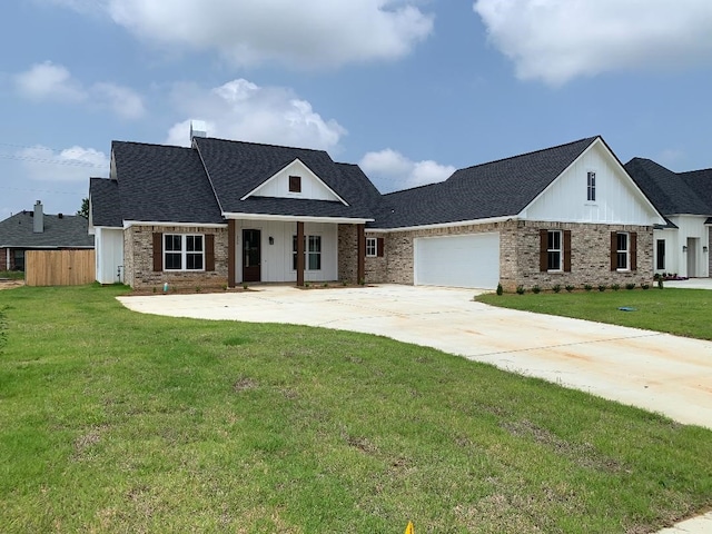 view of front of home with a garage and a front yard