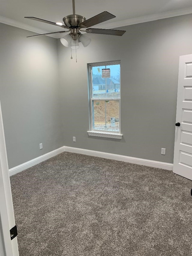 carpeted empty room with crown molding and ceiling fan