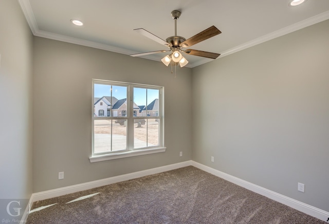 carpeted empty room featuring crown molding and ceiling fan