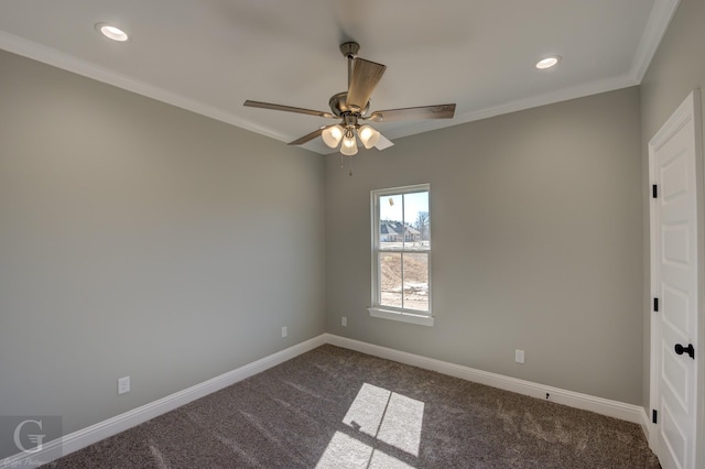 spare room featuring crown molding, carpet, and ceiling fan