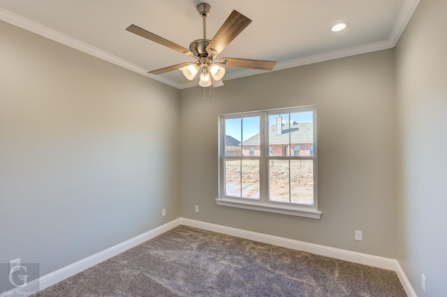 carpeted spare room with crown molding and ceiling fan