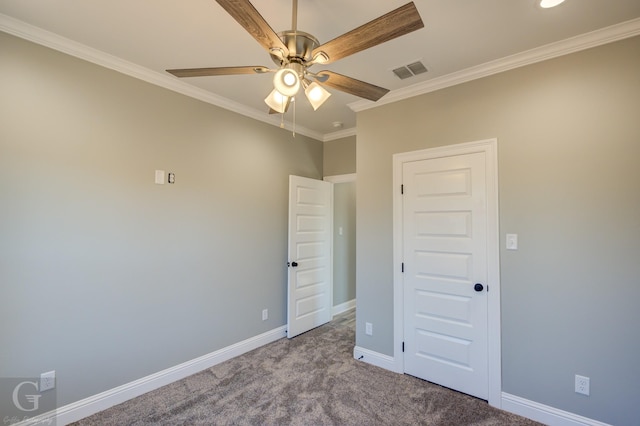 unfurnished bedroom featuring ceiling fan, ornamental molding, and carpet floors