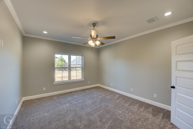 carpeted spare room with ceiling fan and ornamental molding