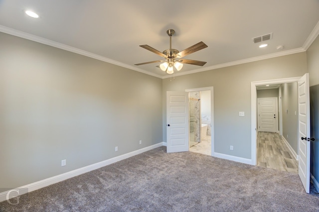 unfurnished bedroom with ceiling fan, ensuite bath, ornamental molding, and light carpet