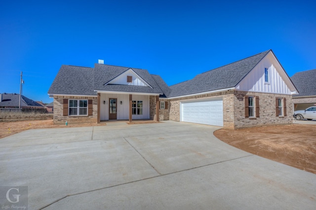 view of front of house featuring a garage and covered porch