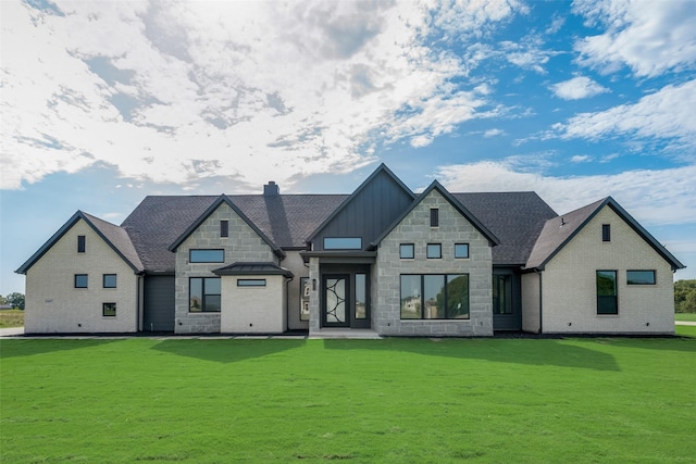 view of front of home with a front lawn