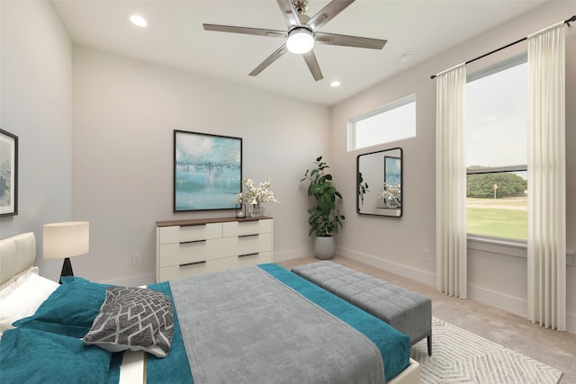 bedroom featuring ceiling fan and light carpet