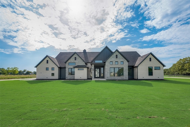 view of front of home with a front lawn