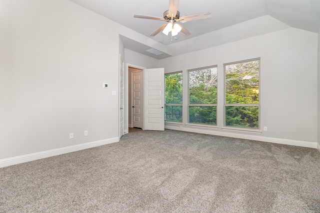 empty room with carpet, lofted ceiling, and ceiling fan