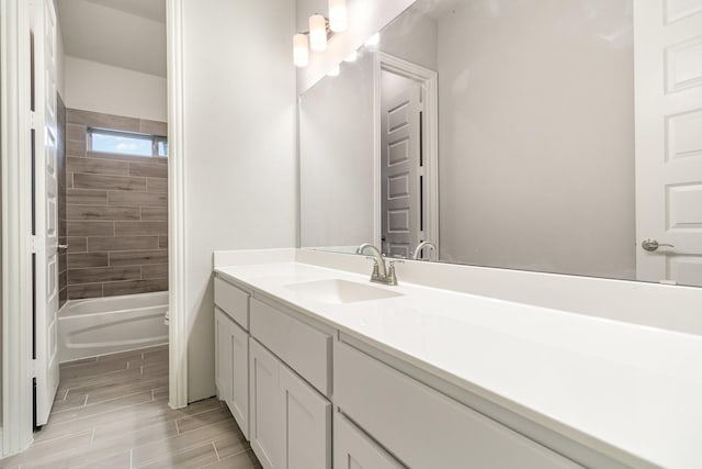 full bathroom with bathtub / shower combination, vanity, and wood tiled floor