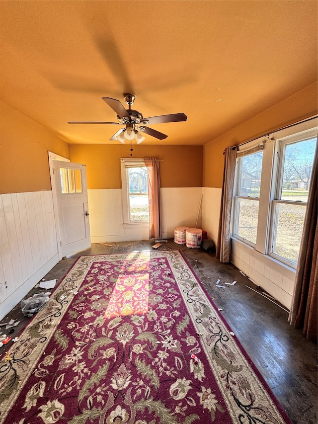 interior space with ceiling fan and hardwood / wood-style floors