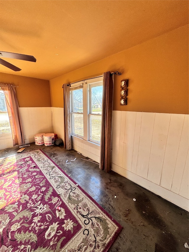 bedroom with ceiling fan and a textured ceiling