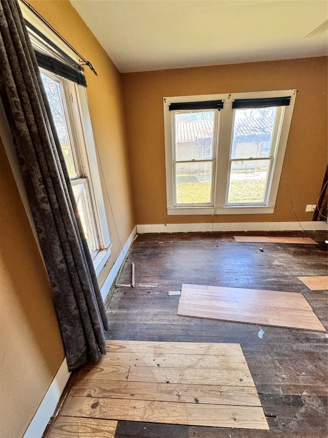 interior space featuring dark hardwood / wood-style floors and plenty of natural light