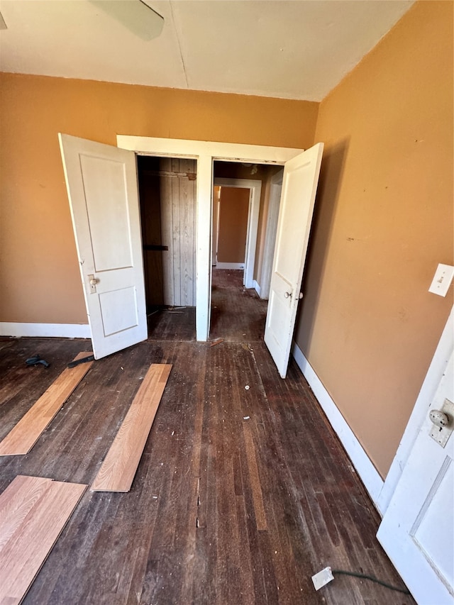 unfurnished bedroom featuring dark hardwood / wood-style floors