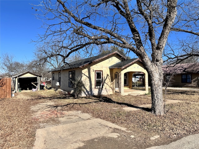 ranch-style home with a carport