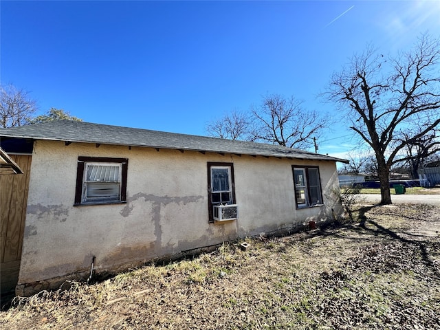 view of side of home with cooling unit