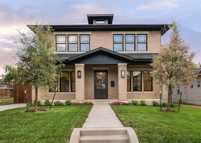 view of front of property with a yard