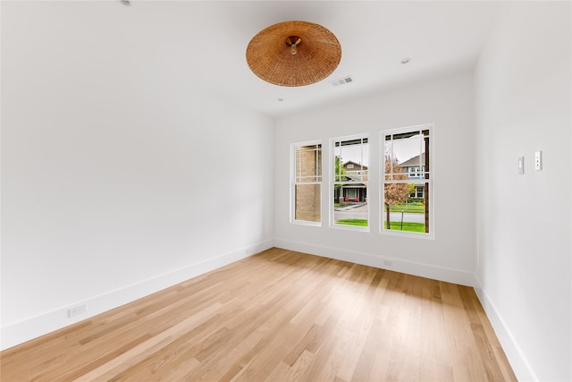 unfurnished room featuring light wood-type flooring