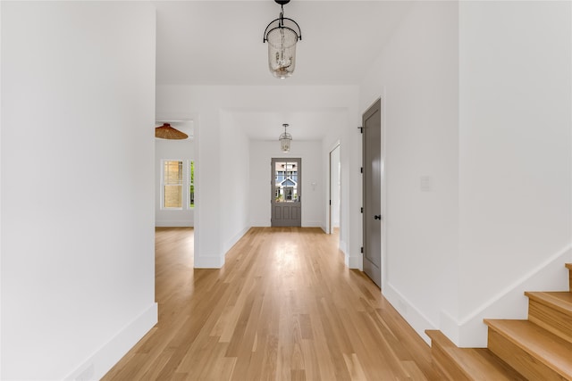 hall with light wood-type flooring