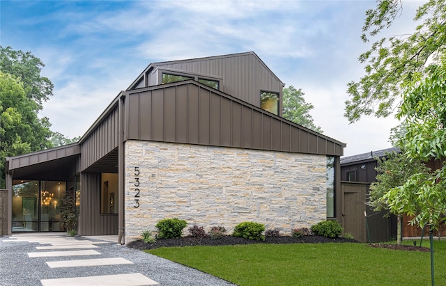 contemporary home with a front lawn