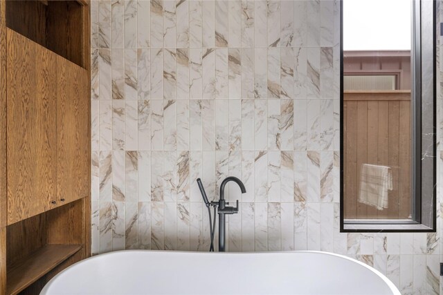 bathroom with a bathing tub