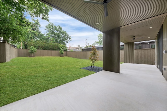 view of yard featuring a patio and ceiling fan