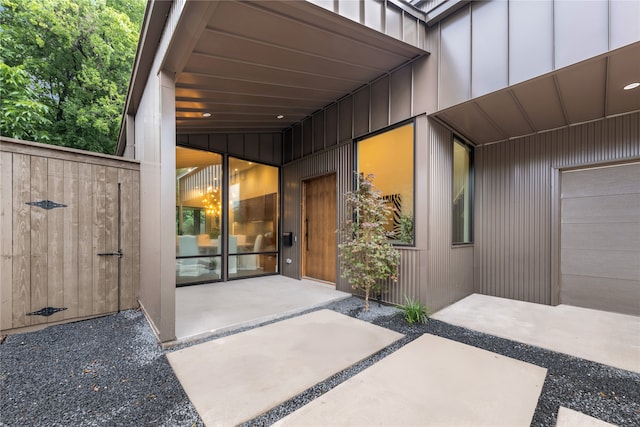 doorway to property with a garage