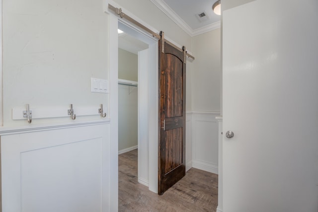 bathroom featuring ornamental molding and hardwood / wood-style floors