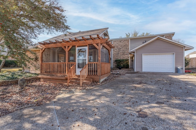 view of front of property featuring a porch and a garage