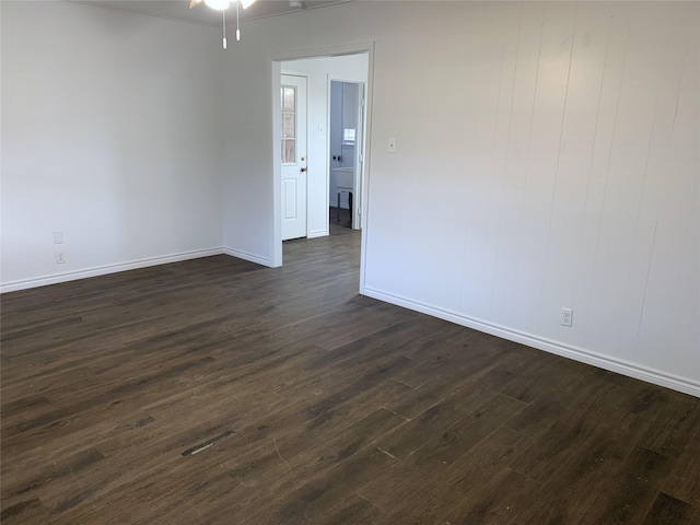 empty room featuring dark hardwood / wood-style flooring