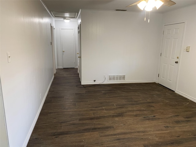 unfurnished room featuring ceiling fan and dark hardwood / wood-style flooring