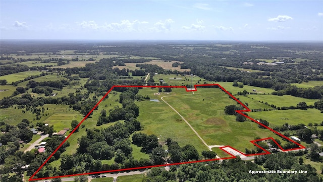 birds eye view of property with a rural view