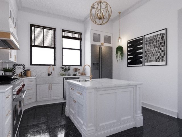 kitchen featuring custom exhaust hood, hanging light fixtures, high end stove, black fridge, and a kitchen island with sink