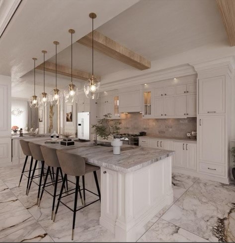 kitchen featuring white cabinetry, white fridge, a spacious island, and light tile patterned floors