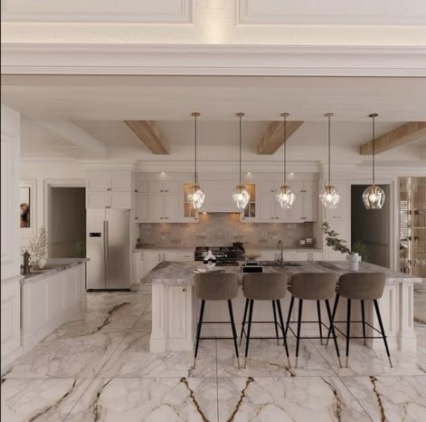 kitchen with stainless steel fridge with ice dispenser, beam ceiling, a large island with sink, and hanging light fixtures