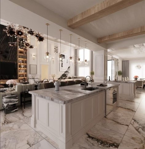 kitchen with beam ceiling, light tile patterned floors, sink, and pendant lighting