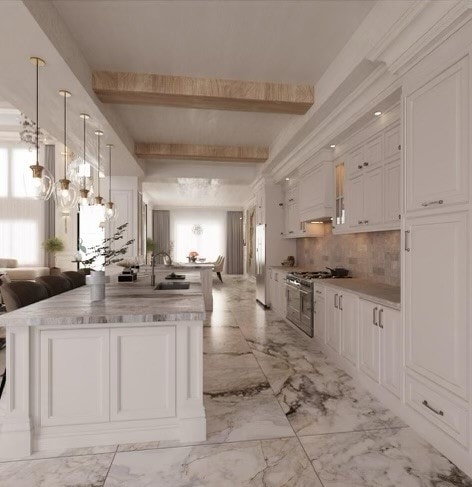 kitchen featuring beam ceiling, white cabinetry, light tile patterned flooring, and decorative light fixtures