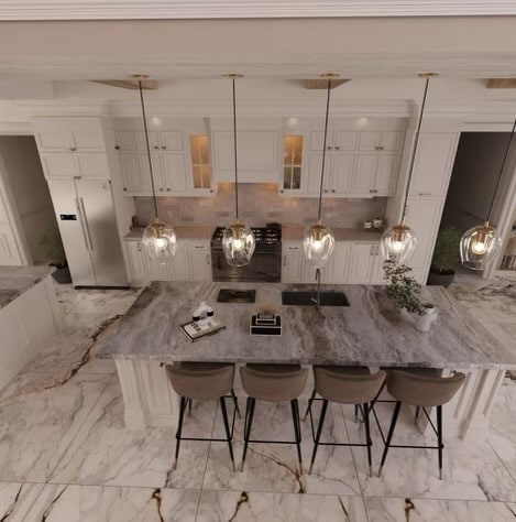 kitchen featuring light tile patterned flooring, pendant lighting, backsplash, and white cabinetry