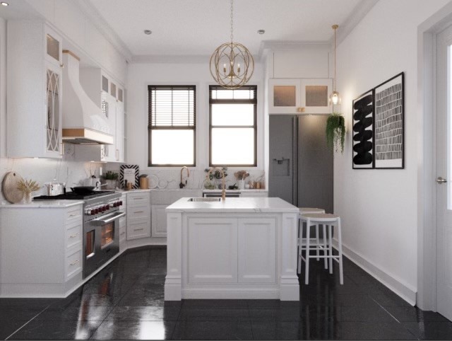 kitchen featuring dark tile patterned floors, white cabinetry, custom range hood, stainless steel appliances, and a center island with sink