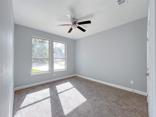 unfurnished room with ceiling fan and carpet floors